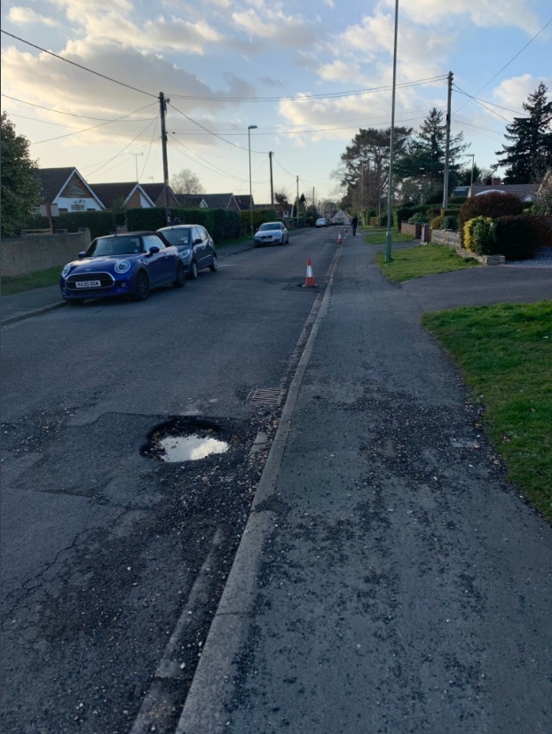 A pothole on Middle Road was reported in November. Traffic cones have been put in place to stop cars from driving through it.