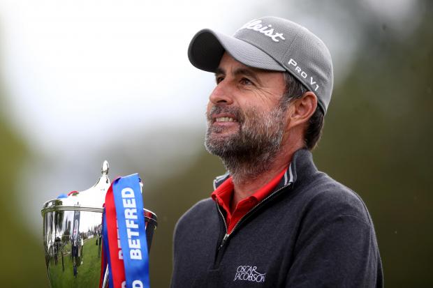 England's Richard Bland poses with the Trophy after winning the Betfred British Masters at The Belfry, Sutton Coldfield. Picture date: Saturday May 15, 2021..