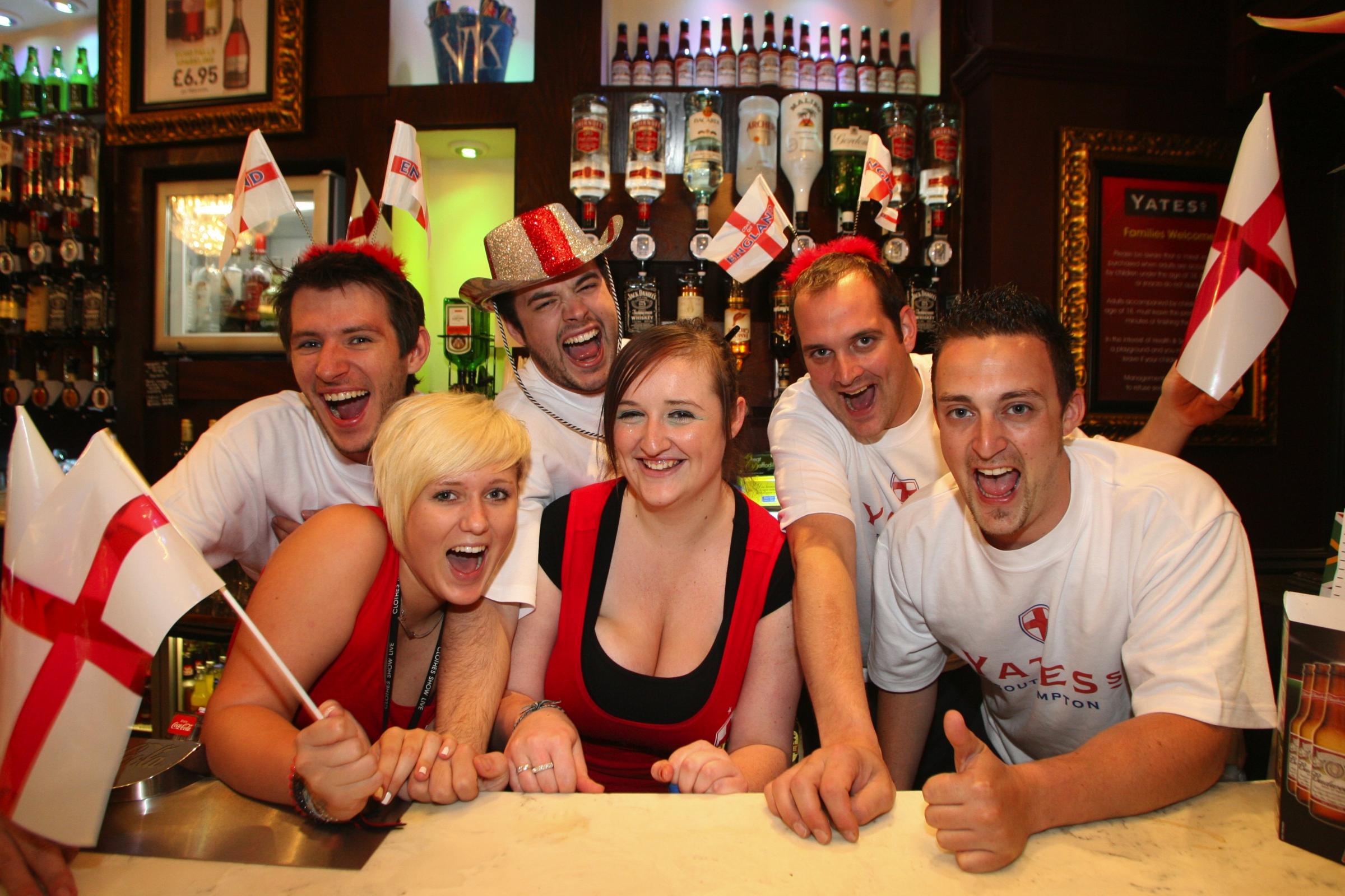 The staff at Yates in Southampton cheer on England ahead of their World Cup knockout match against Germany on Sunday, 27 June 2010 in South Africa.