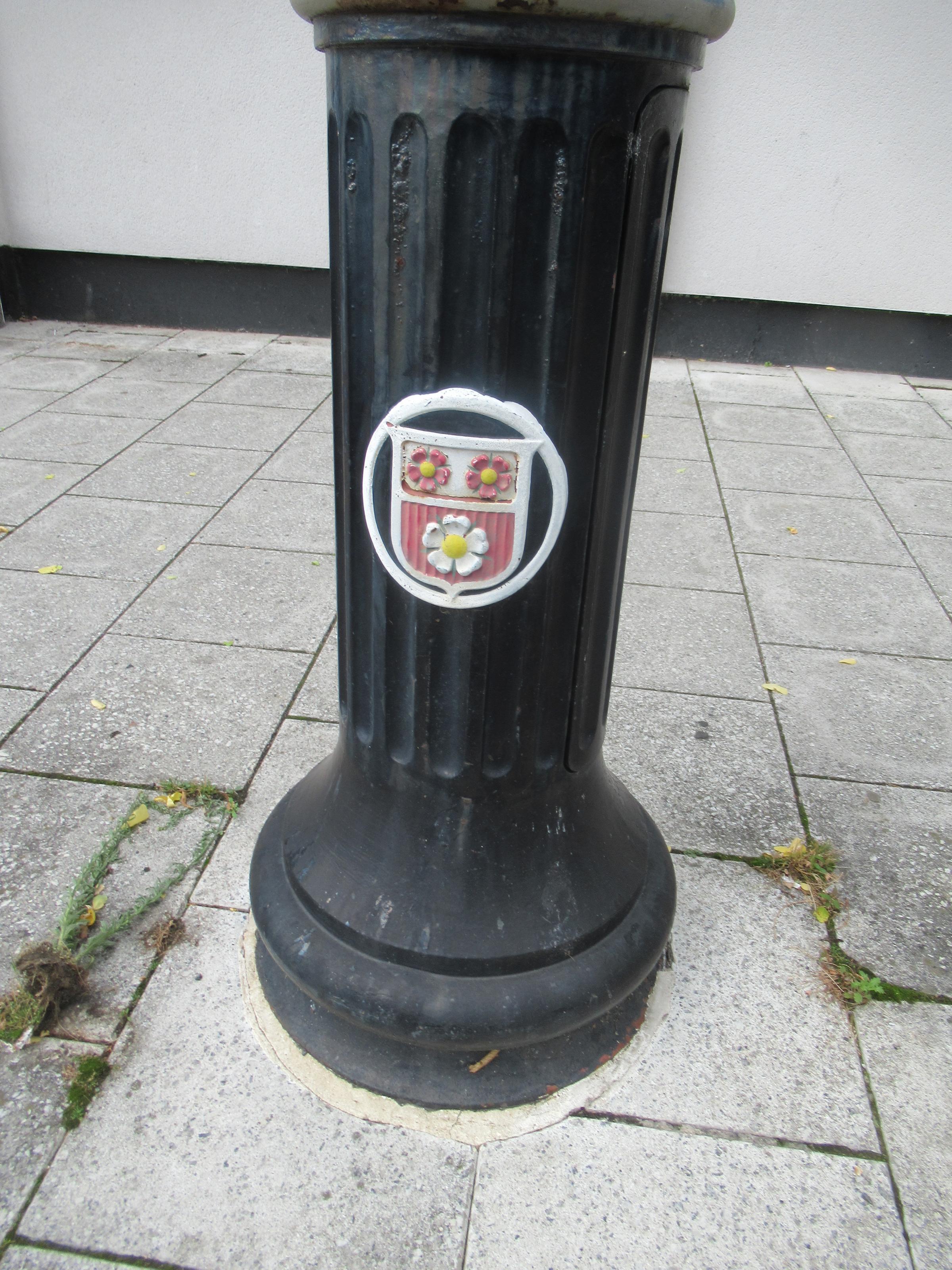 Town shield on tram power stanchion.