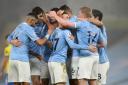 Manchester City's Phil Foden (centre) celebrates with his team-mates after scoring his side's first goal of the game during the Premier League match at Etihad Stadium, Manchester. PA Photo. Picture date: Wednesday January 13, 2021. See PA story