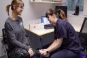 Emily Ball, right, clinical director of Active Step Foot & Ankle Clinic in Whiteley, at work