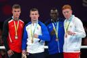 Wales' Bevan Taylor, silver, Scotland's Sean Lazzerini, gold, Tanzania's Yusuf Lu Changalawe, bronze and England's Aaron Bowen, bronze after the Men's Light Heavy 75-80kg boxing at The NEC on day ten of the 2022 Commonwealth Games in