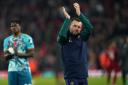 Southampton manager Nathan Jones applauds the fans following the Premier League match at Anfield, Liverpool. Picture date: Saturday November 12, 2022.