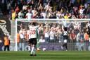 Theo Walcott watches on as Fulham celebrate scoring at St Mary's.