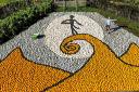 Tom Nelson of Sunnyfields Farm in Totton, Hants puts the finishing touches to a giant artwork paying tribute to Tim Burton's The Nightmare Before Christmas on its 30th anniversary, using 10,000 pumpkins and squash.