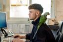 Ollie Rickard with Miguel, the Beaulieu River parrot