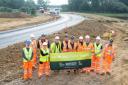 Workers from Luddon Construction celebrating getting halfway through the road scheme