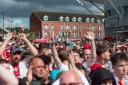Saints fans celebrate promotion from the Championship at St Mary's Stadium.