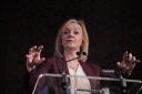 Former prime minister Liz Truss is facing criticism for appearing on a right-wing platform (Victoria Jones/PA)