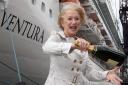 Dame Helen Mirren with a bottle of Champagne in front of P&O Cruises Ventura ship ahead of the official naming ceremony. PRESS ASSOCIATION Photo. Picture date: Wednesday April 16, 2008. Two Royal Marine Commandos will smash bottles of Champagne against