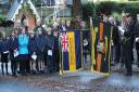 Standard bearers lower their flags in tributes to First World War heroes in Hursley