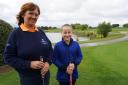 Schoolgirl Poppy Cooper with Cams Hall Estate Golf Club's ladies' captain Lt Commander Isabel Kent RN (rtd)