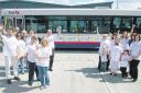 The Have A Heart campaign bus advert is unveiled at Empress Rd bus depot watched by campaign supporters.
