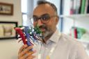 Arjun Takhar, consultant hepatobiliary and pancreatic cancer surgeon at University Hospital Southampton, holding a 3D printed model of a liver used for surgeons to plan complex cancer surgery