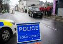 Emergency workers gather in Albert Road near to the Torpoint Ferry crossing in Plymouth, where a suspected Second World War explosive device, discovered in a garden in St Michael Avenue in the Keyham area of Plymouth, will be taken by military convoy to