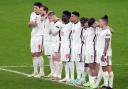 England's Jadon Sancho (17) and Bukayo Saka alongside team mates during the penalty shoot out following the UEFA Euro 2020