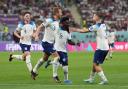 England's Bukayo Saka (centre) celebrates scoring their side's fourth goal of the game during the FIFA World Cup Group B match at the Khalifa International Stadium in Doha, Qatar. Picture date: Monday November 21, 2022.