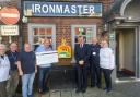 Fareham Borough council leader Cllr Sean Woodward joins the teams from The Ironmaster and The Alex Wardle Foundation to launch the pub's new defibrillator