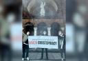 Protestors were seen outside a Southampton church holding a banner and smoke grenades