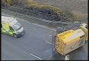 The overturned road sweeper on the M3