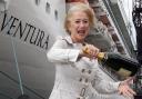Dame Helen Mirren with a bottle of Champagne in front of P&O Cruises Ventura ship ahead of the official naming ceremony. PRESS ASSOCIATION Photo. Picture date: Wednesday April 16, 2008. Two Royal Marine Commandos will smash bottles of Champagne against
