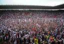 Saints fans celebrating promotion after beating Walsall on the final day in League One