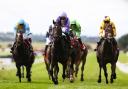 Comanche Brave (centre) winning at the Curragh (Evan Treacy/PA)