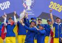 Anna Nordqvist holds the trophy aloft after her team won the Solheim Cup (Alastair Grant/AP)