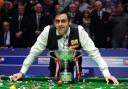 England's Ronnie O'Sullivan celebrates his victory with the trophy after the final during the Final of the Betfred.com World Snooker Championships at the Crucible Theatre, Sheffield. PRESS ASSOCIATION Photo. Picture date: Monday May 7, 2012. See
