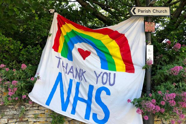 Stock photo of a supportive NHS banner (Pexels)