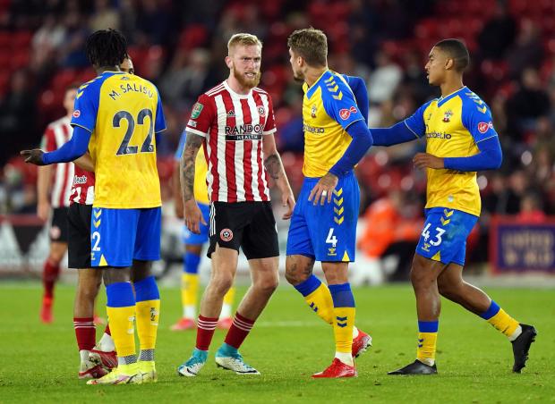 Daily Echo: Yan Valery (right) has only played in the EFL Cup for Saints so far this season (Pic: PA)