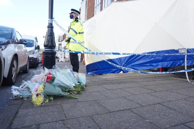 Police in Lymington High Street following the fatal stabbing of fisherman Max Maguire.