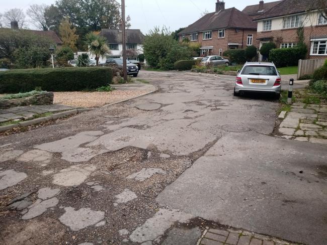 Potholes can be found all along the road in Bassett.
