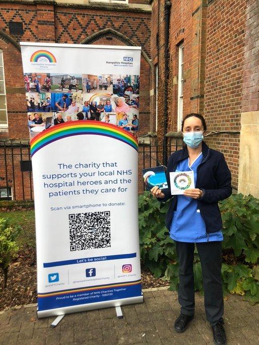 Laura Ghosh with her Christmas card for Hampshire Hospitals Charity