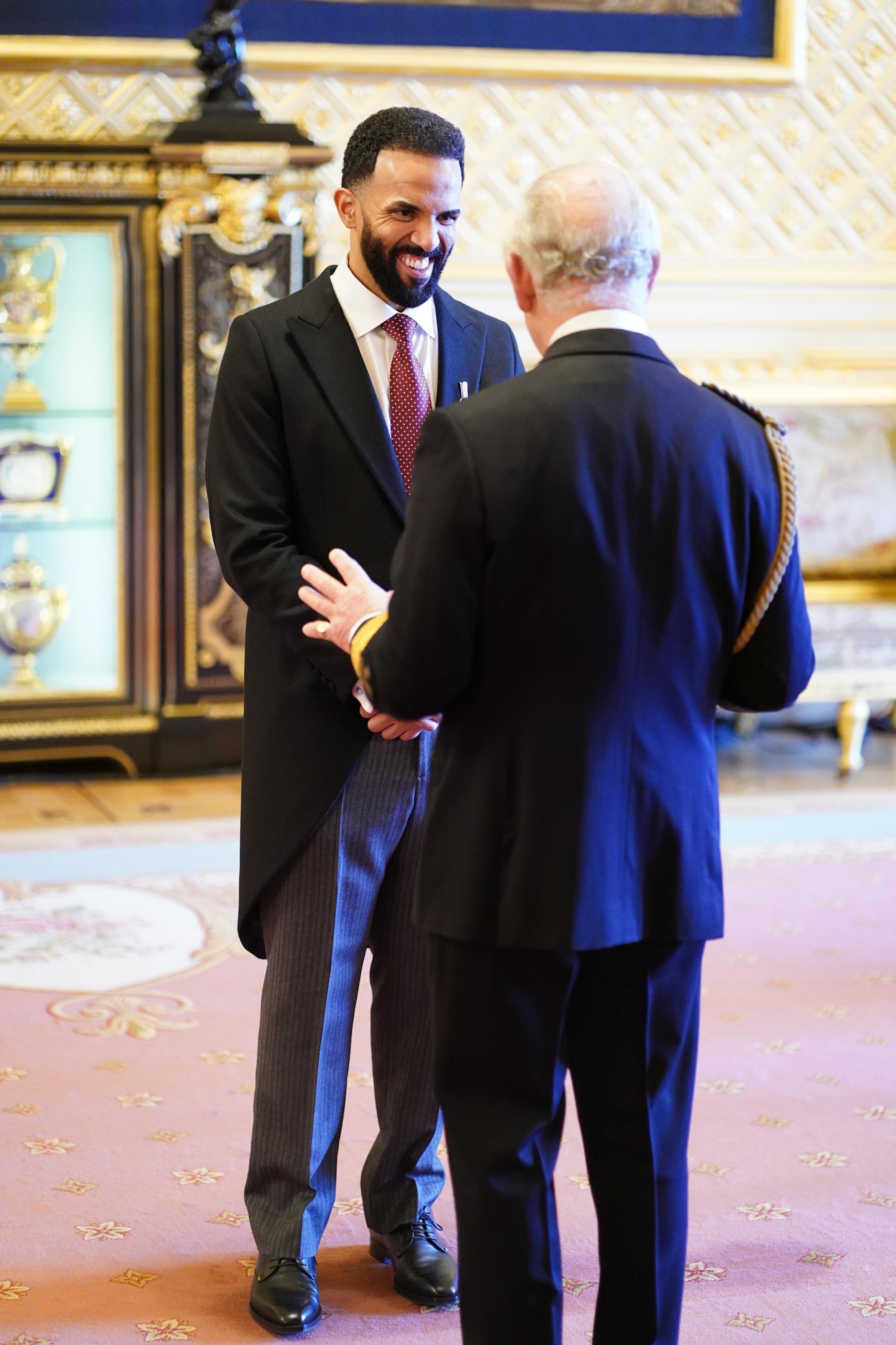 Mr. Craig David is made an MBE (Member of the Order of the British Empire) by the Prince of Wales at Windsor Castle. Picture date: Wednesday December 15, 2021.