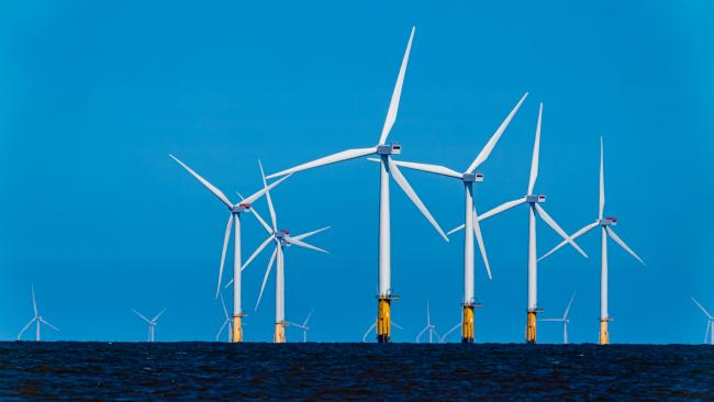 Large Offshore wind turbines farm in the North Sea.