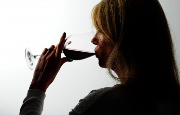 Daily Echo: A woman drinking red wine. Credit: PA