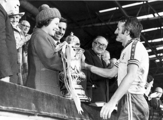 Daily Echo: Saints captain Peter Rodrigues is congratulated by the Queen.