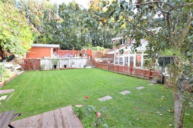 Daily Echo: The garden, summer house and pool. Photo: Rightmove