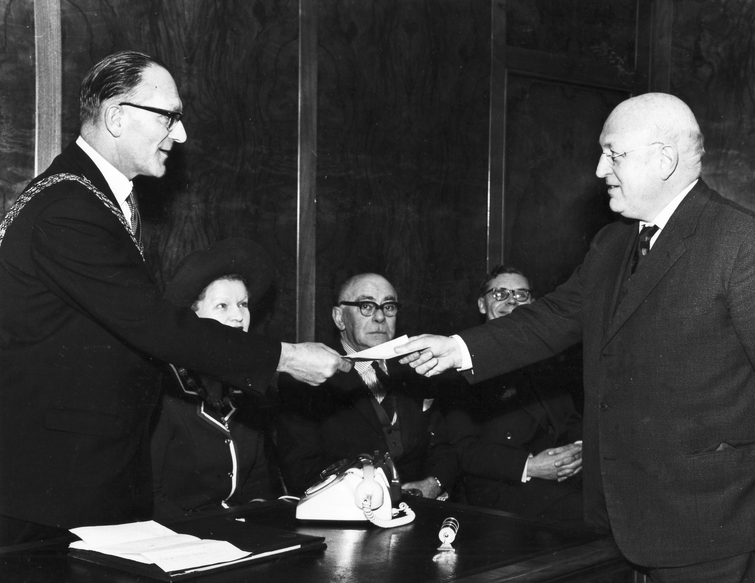Southampton City Status Ceremony, 11 Februuary 1964. Town clerk Norman Scholfield hand the city charter to the Mayor of Southampton Alderman Ronald Pugh. Southern Daily Echo Archives. Neg ref. 3418D/3