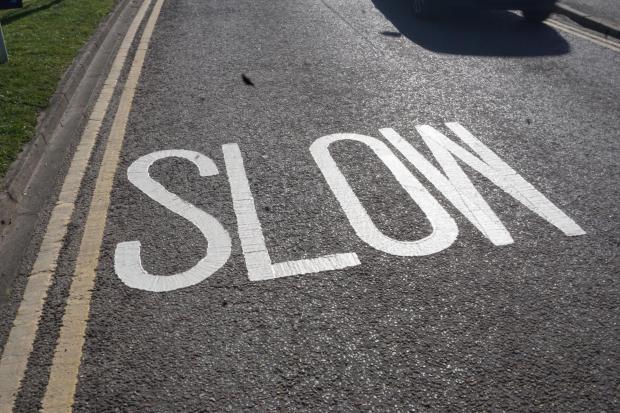 BCP Council have painted slow signs on Chichester Way on the approach to Mudeford Quay, 18 months after a resident painted his road markings scrubbed on the road
