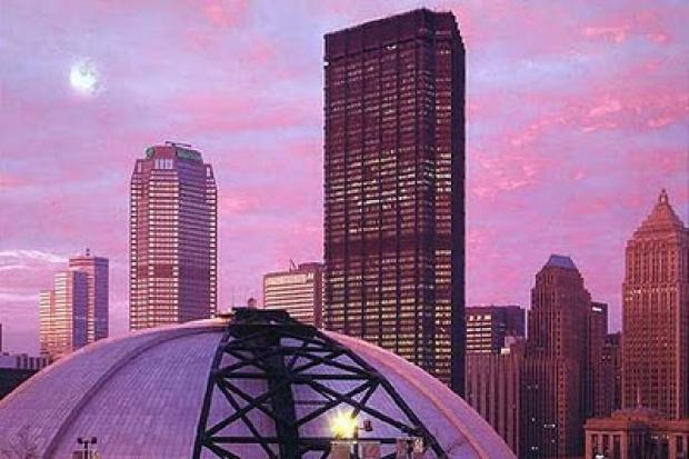 The Mellon arena's iconic dome nestles into the skyline of downtown Pittsburgh.