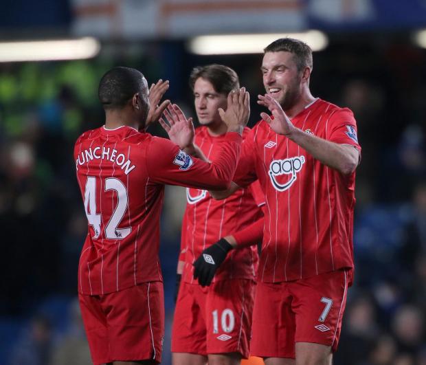 Daily Echo: Lambert celebrates with Puncheon at Stamford Bridge. Image by: PA