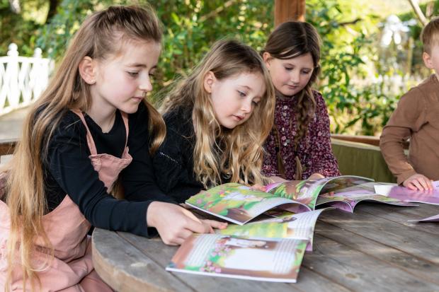 Daily Echo: Children reading Ottilie and Roue 