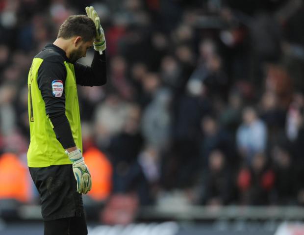 Daily Echo: Bialkowski reacts to his mistake against Blackpool. Image by: PA