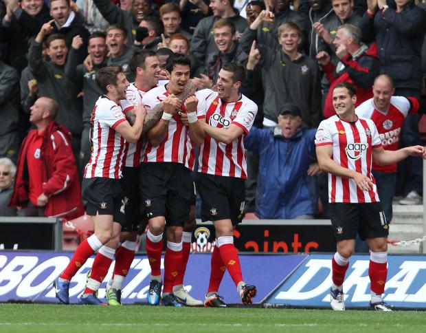 Daily Echo: Fonte celebrates with his teammates after scoring to make it 2-0. Image by: PA