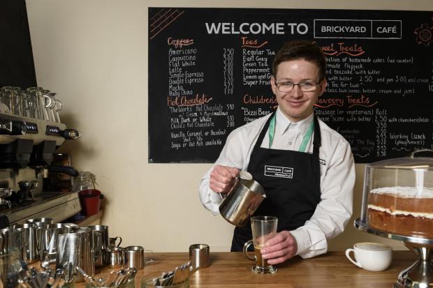 Daily Echo: Corey serves drinks at the revitalised cafe at the Bursledon Brickworks Museum. Pictures: Minstead Trust.