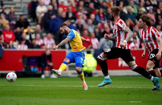 Daily Echo: Adam Armstrong tries his luck against Brentford. Image by: PA