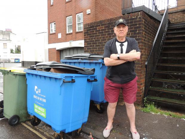 Daily Echo: Denis Bundy stood beside the bins outside his block of flats in Winchester Street